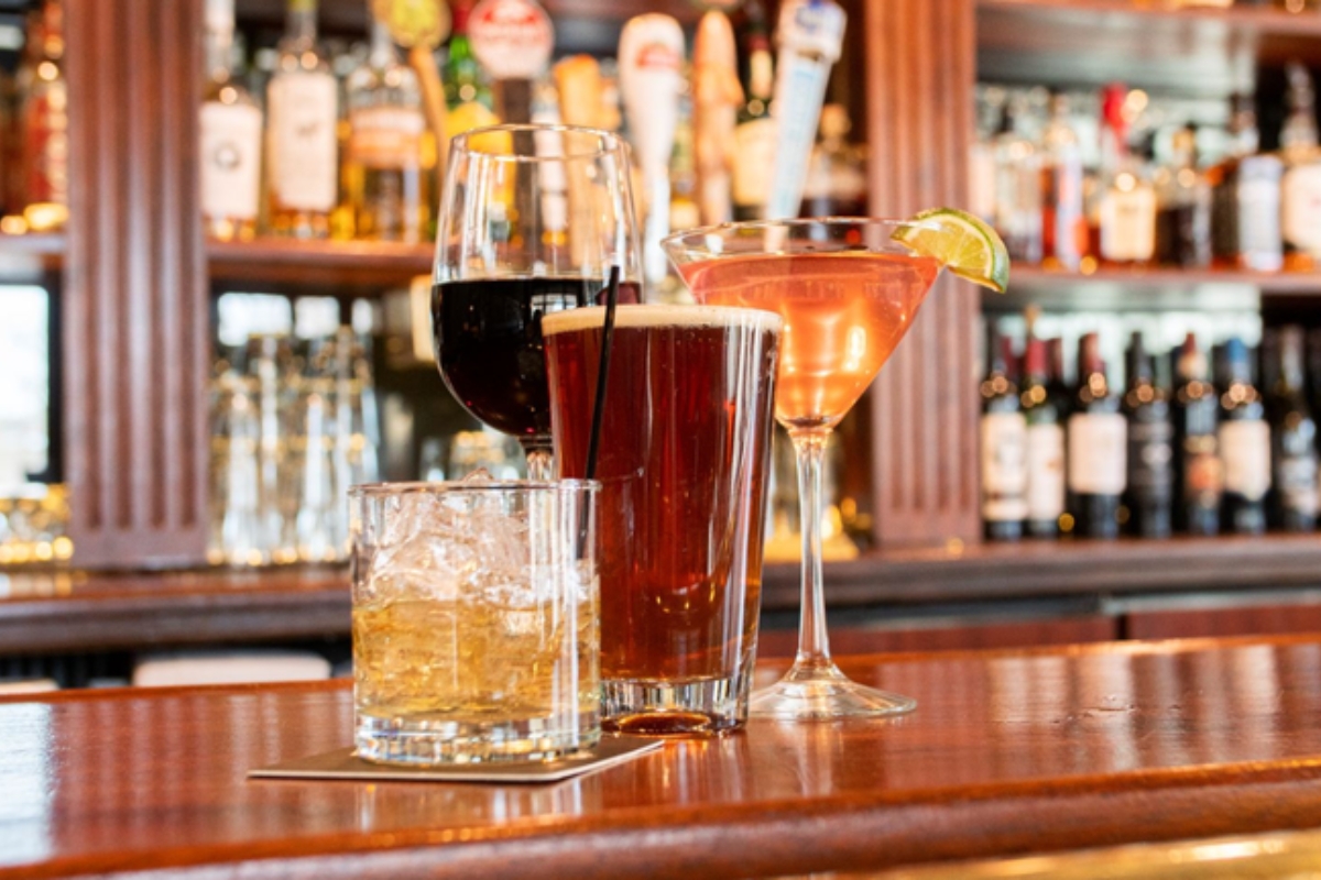 a group of drinks on a bar
