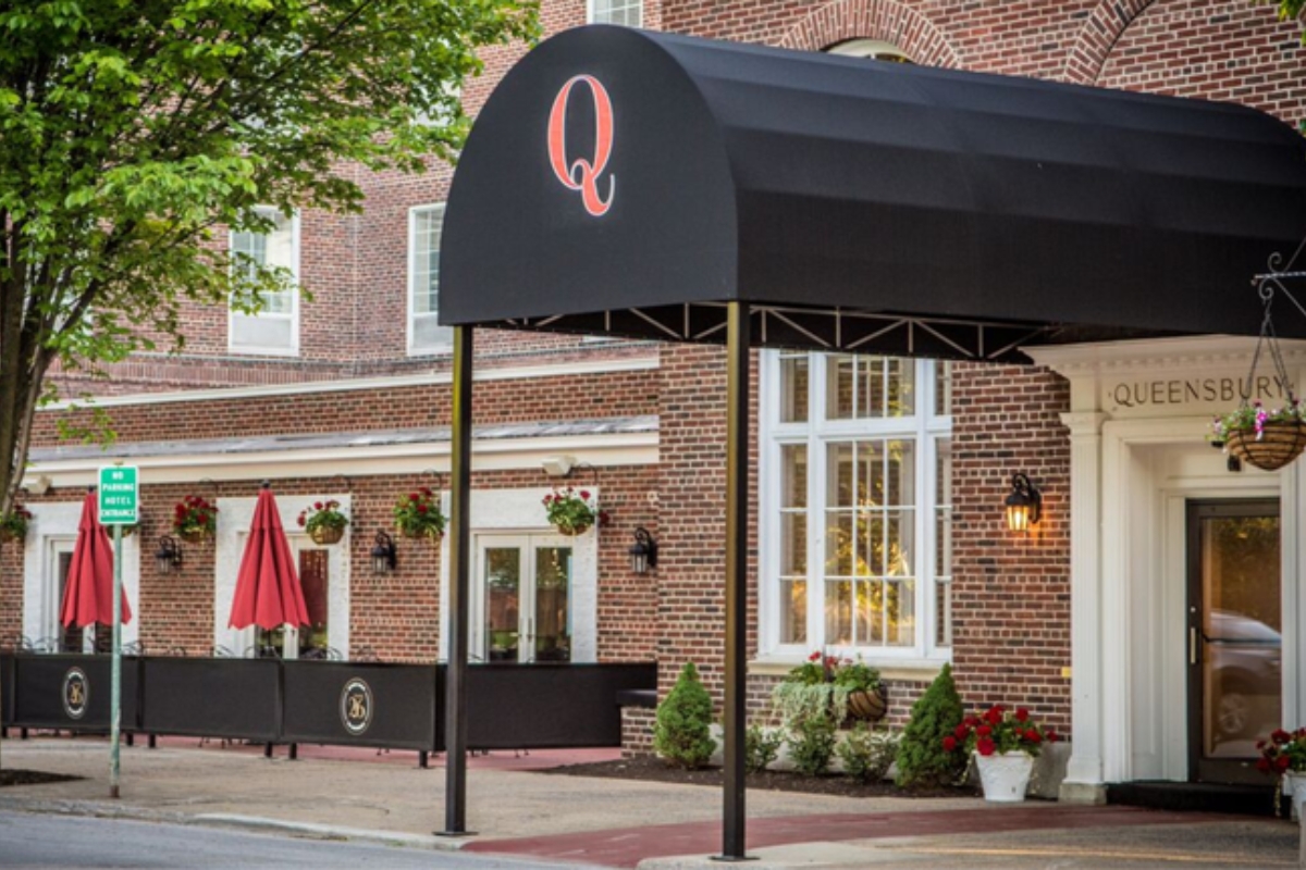 a black awning on a brick building