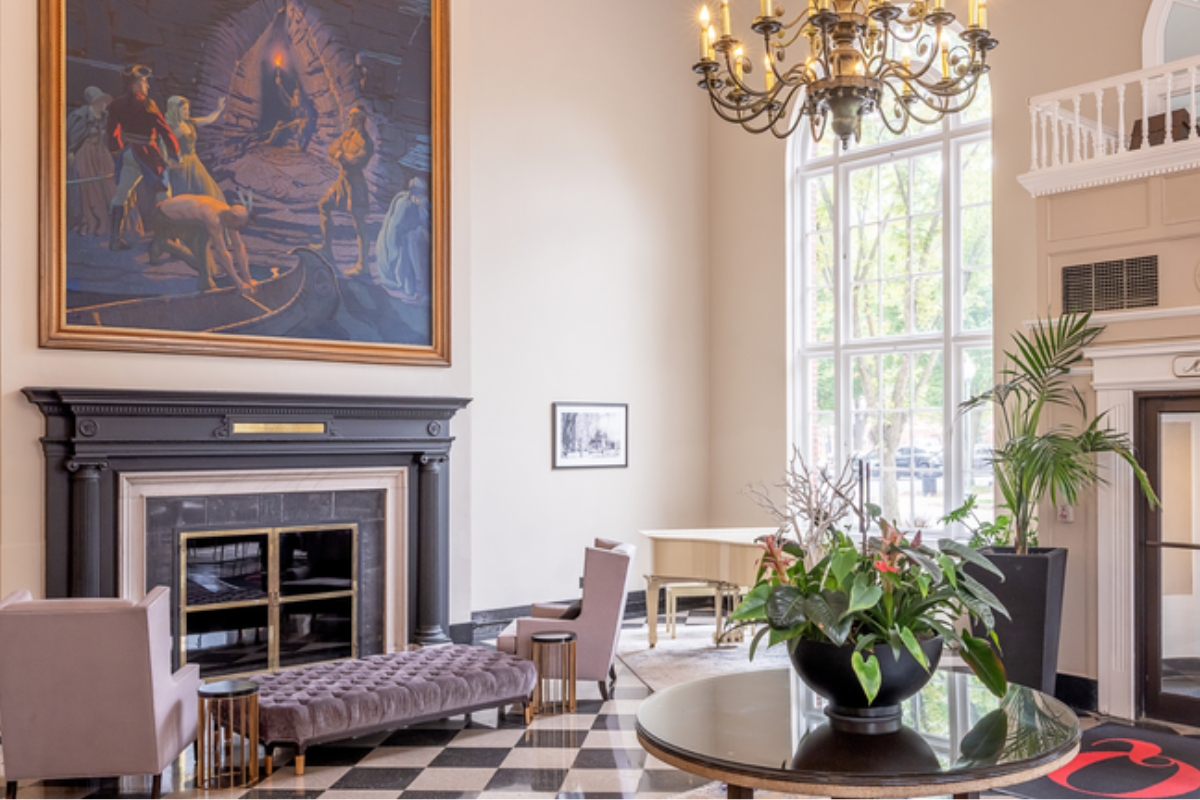 a room with a large painting on the wall