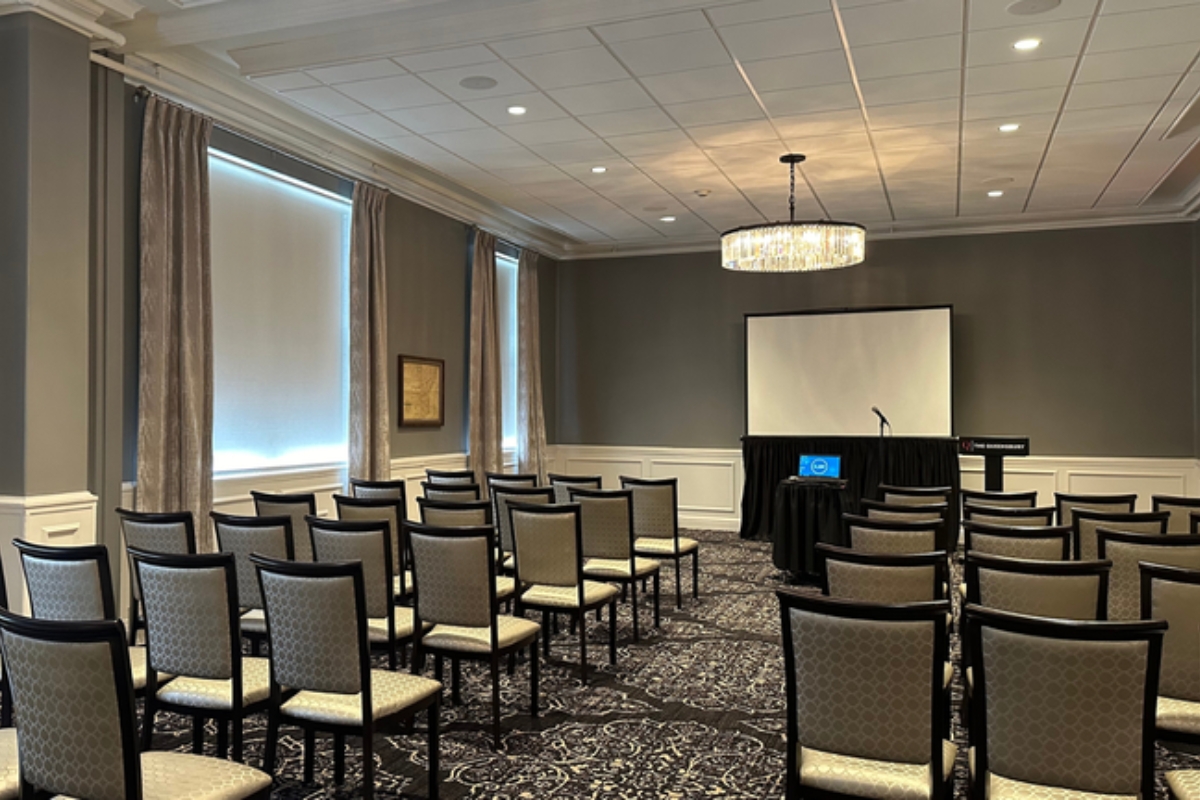 a room with chairs and a projector