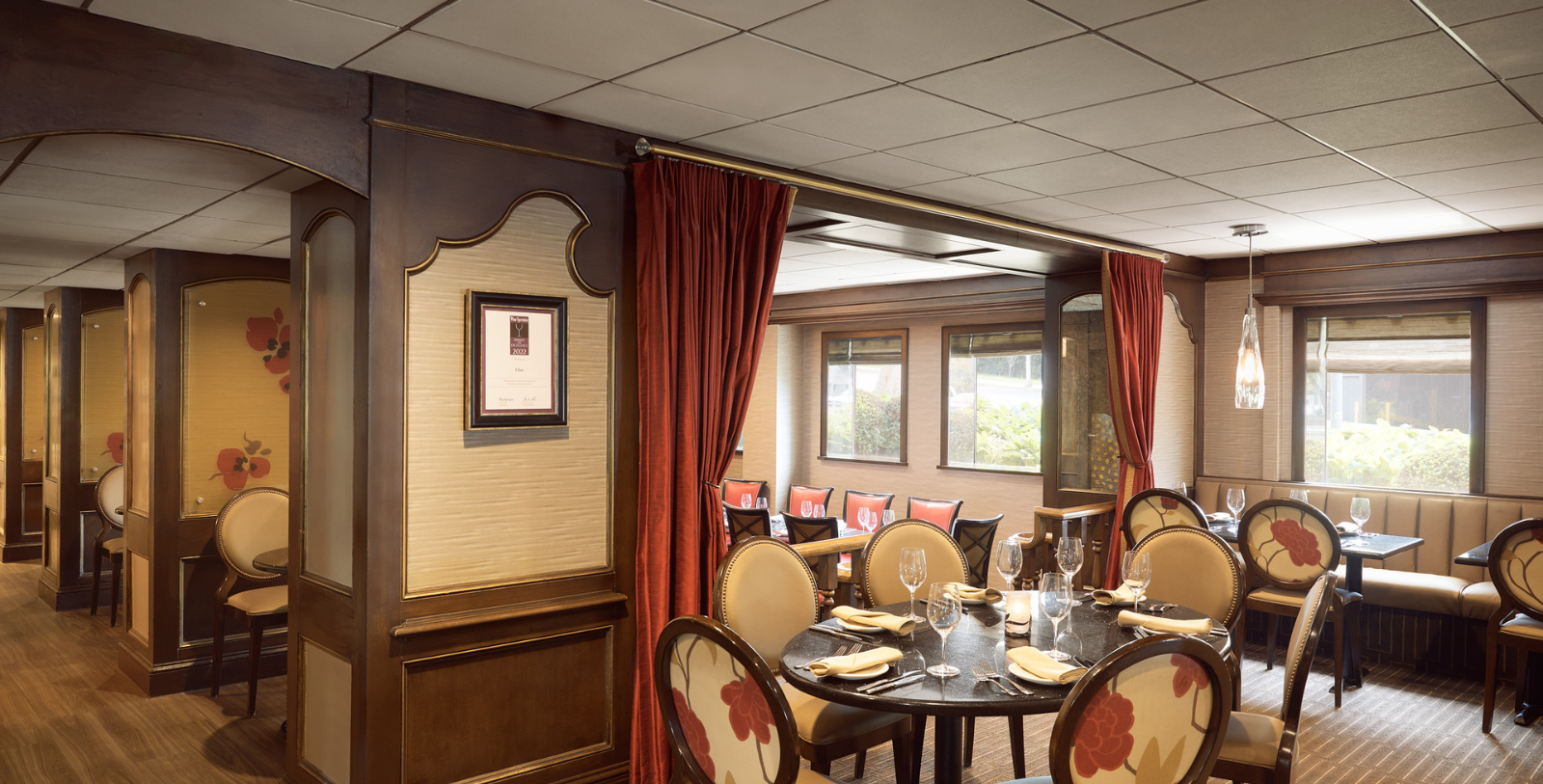 a room with a table set for a dinner
