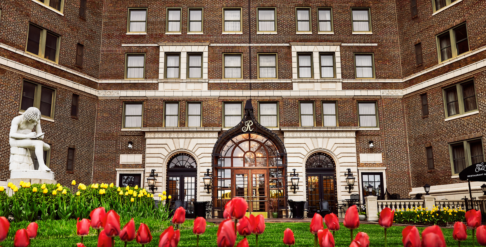 a red tulips in front of a building