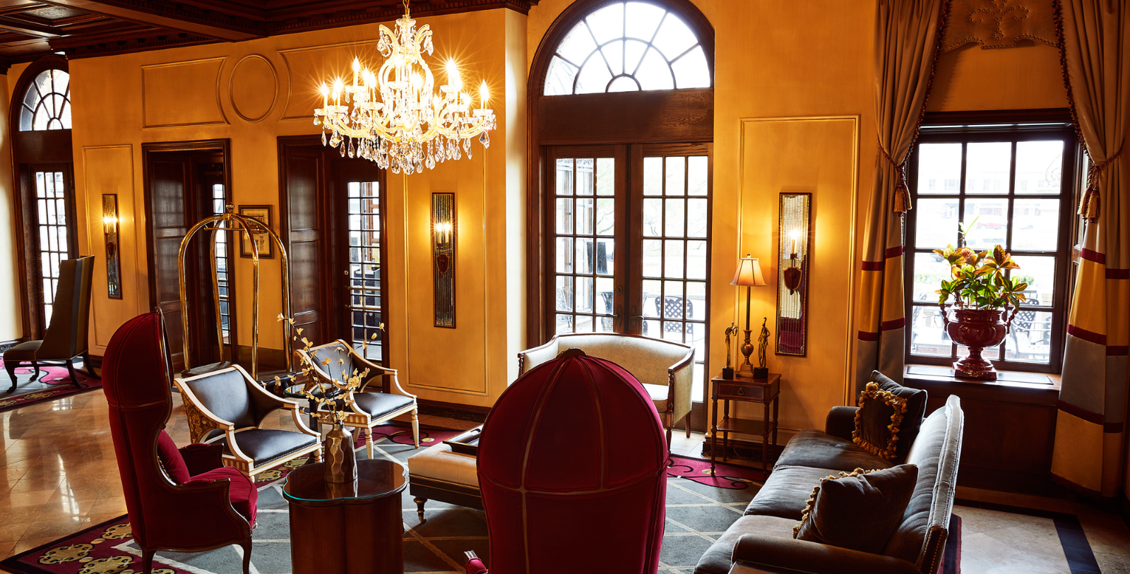 a room with a chandelier and chairs