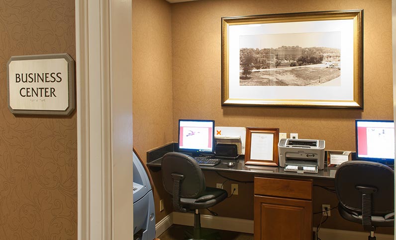 a computer on a desk in a room