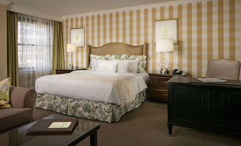 a bedroom with a bed and a table