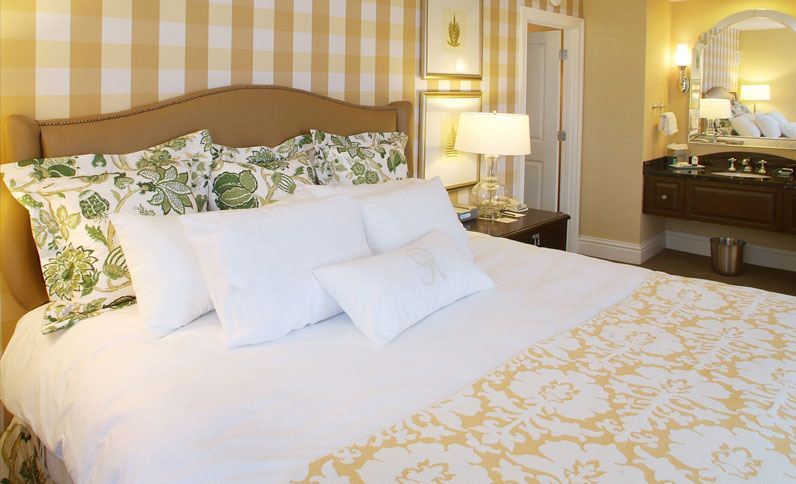 a bed with a lamp on the side