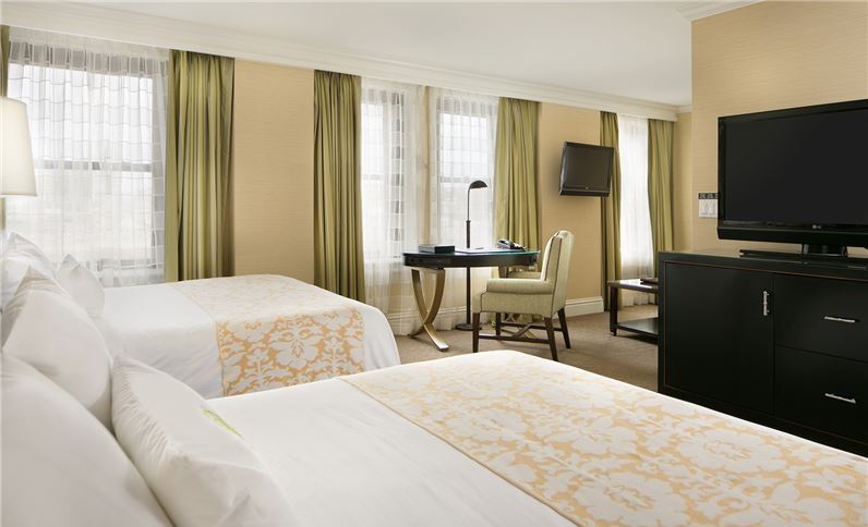 a hotel room with two beds