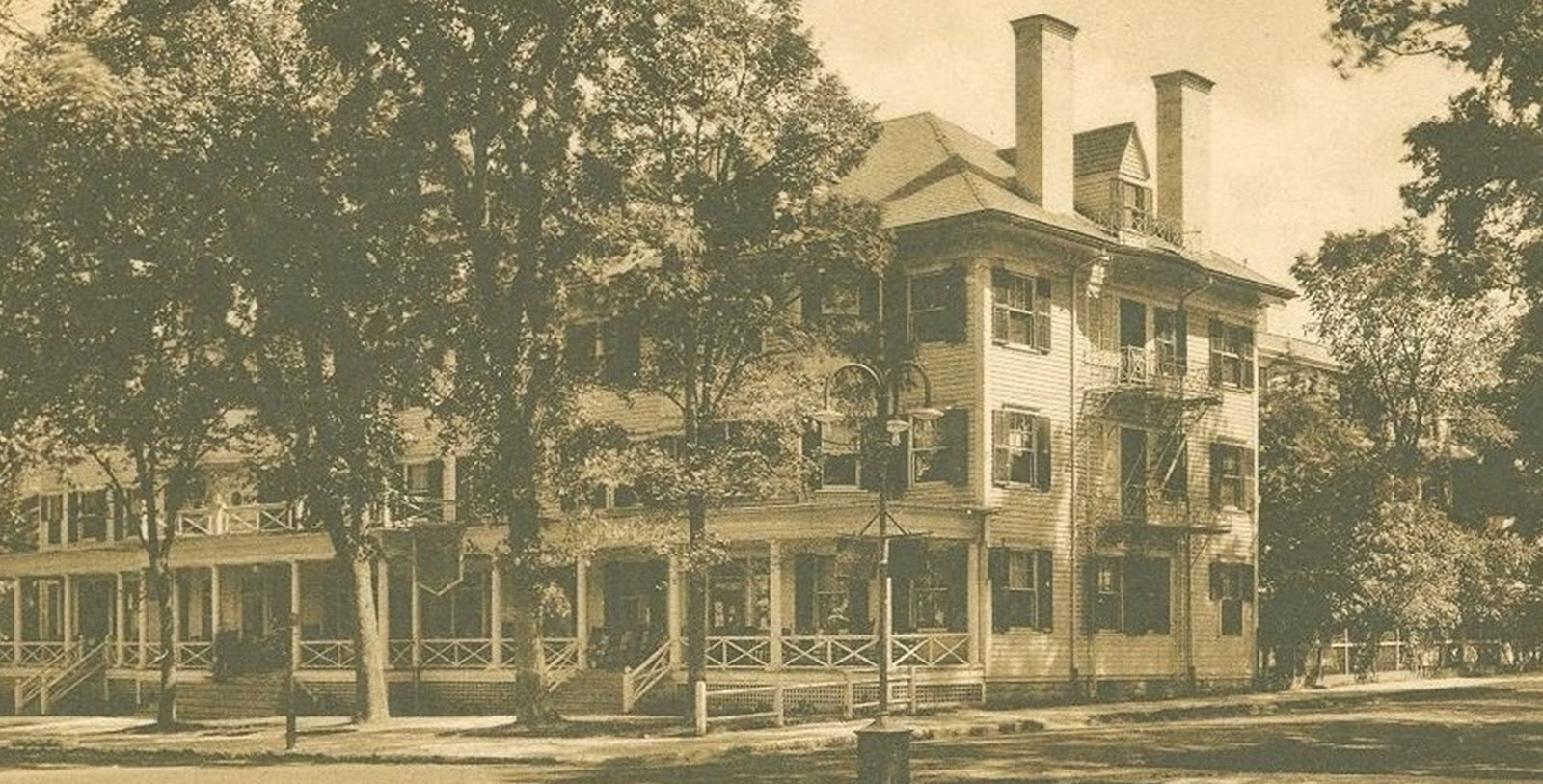 a large building with a tree in front