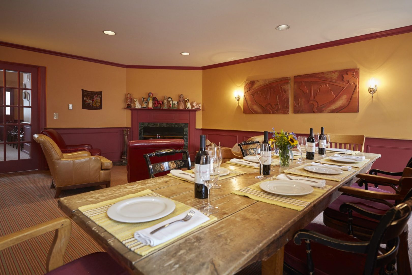 a table with wine glasses and plates on it