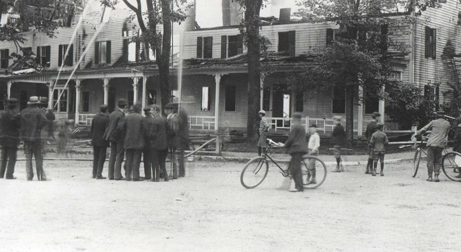 a group of people standing around a building