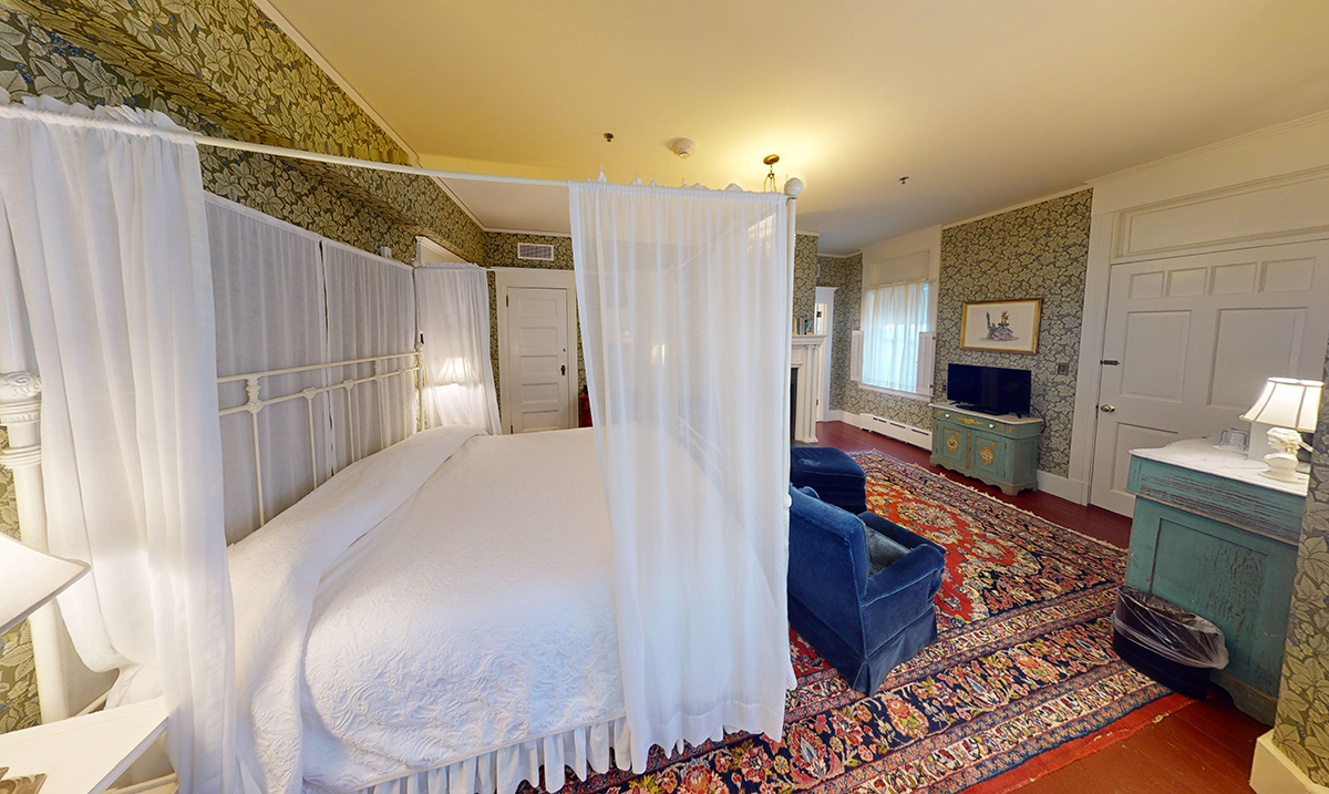 a room with a bed and a chair