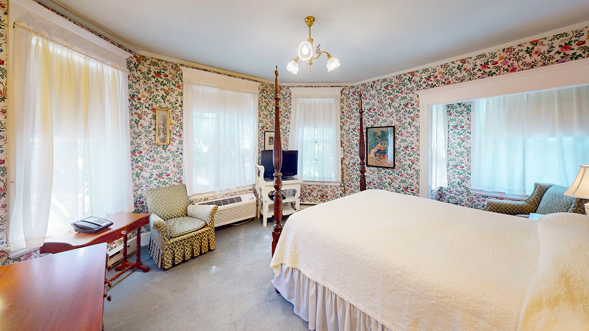 a room with a bed and a chair