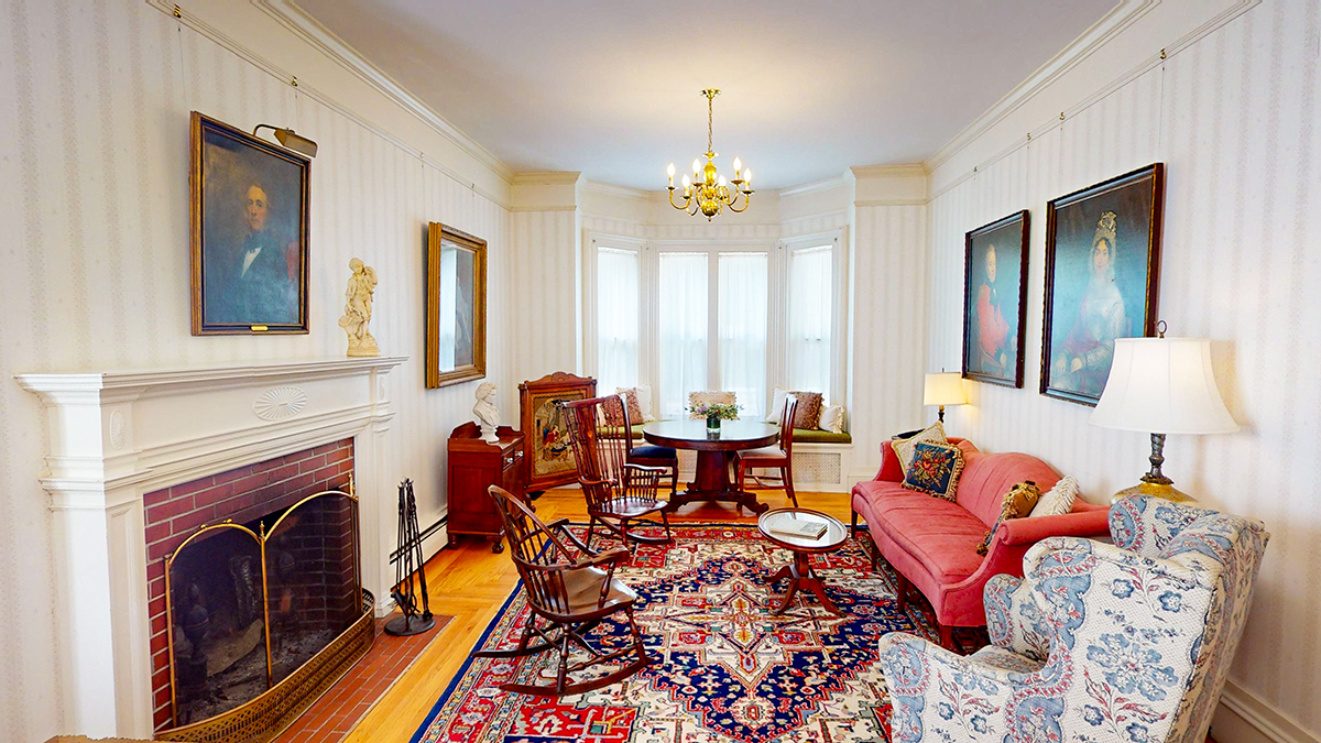 a living room with a fireplace and furniture