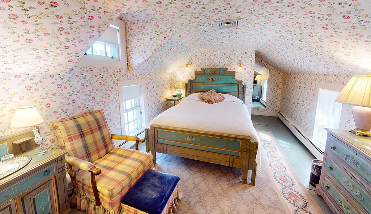 a room with a bed and a chair
