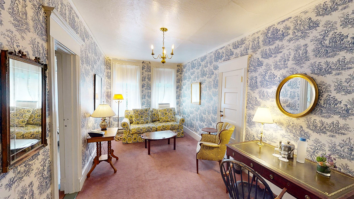 a room with a couch and a desk