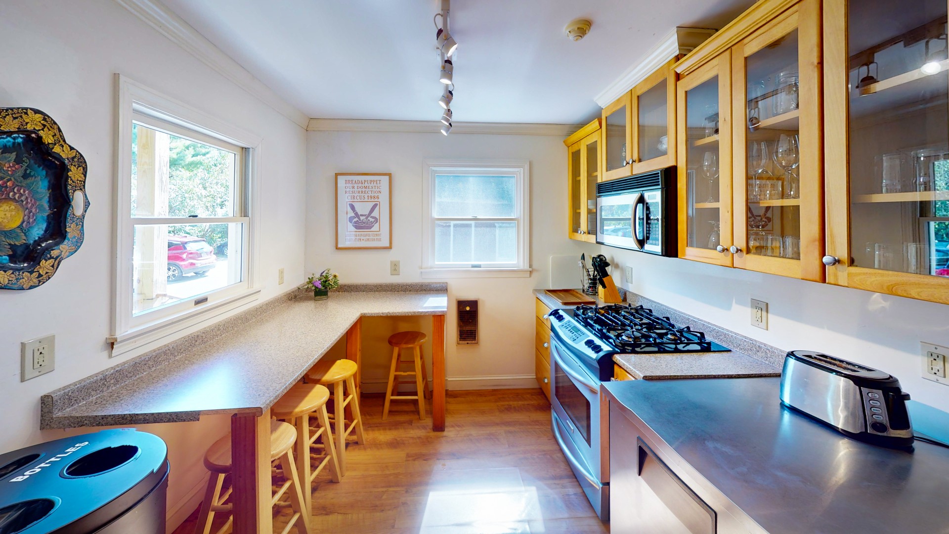 a kitchen with a counter top and a bar stool