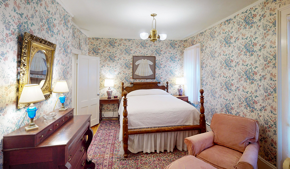 a room with a bed and a chair