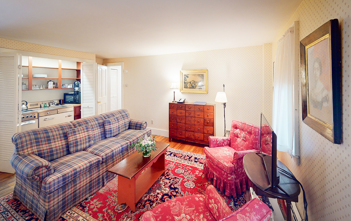 a living room with a couch and a tv