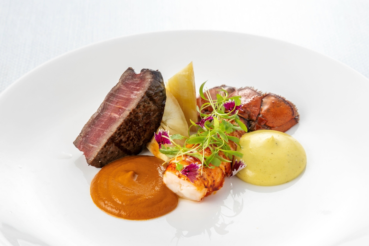 a plate of food with sauce and vegetables