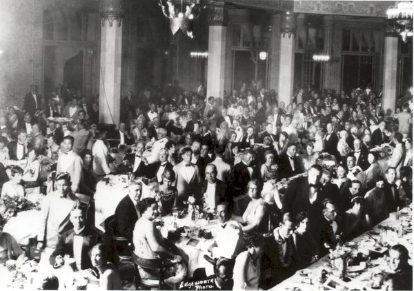 a large group of people sitting at tables
