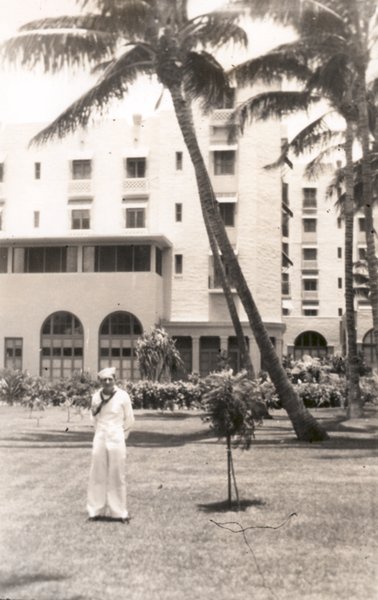 a man standing in front of a building