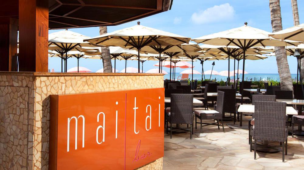 a restaurant with umbrellas and chairs