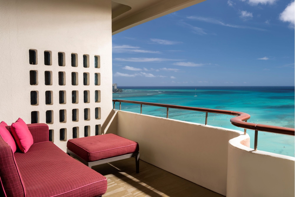 a balcony with a view of the ocean