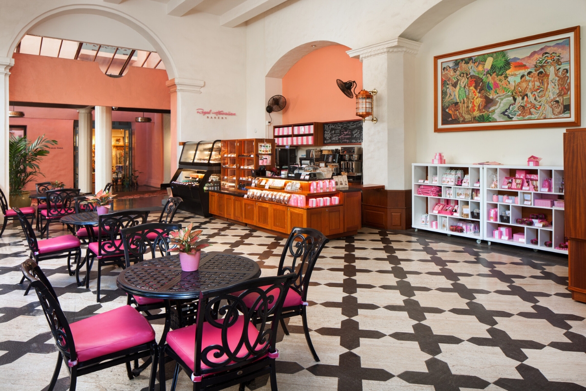 a room with a black and white checkered floor and tables and chairs