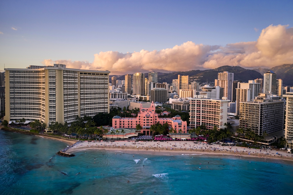 a beach with buildings and a body of water