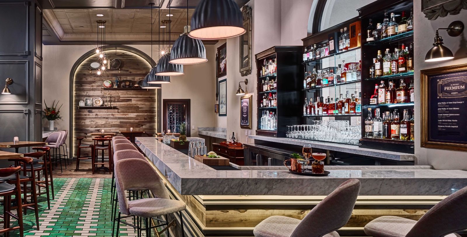 a bar with a counter and chairs