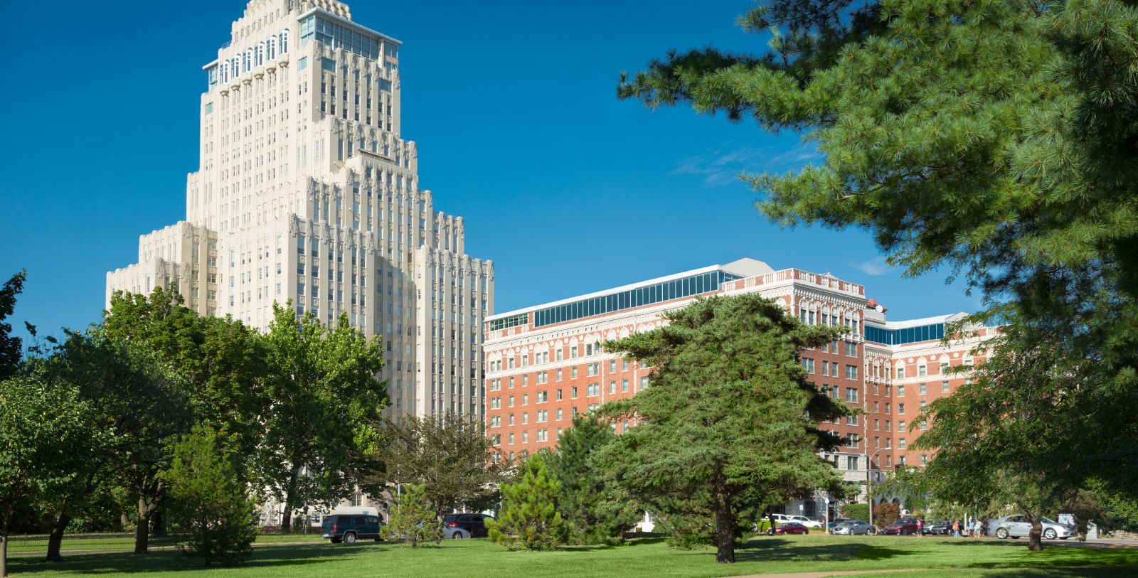 a tall building with trees in front of it