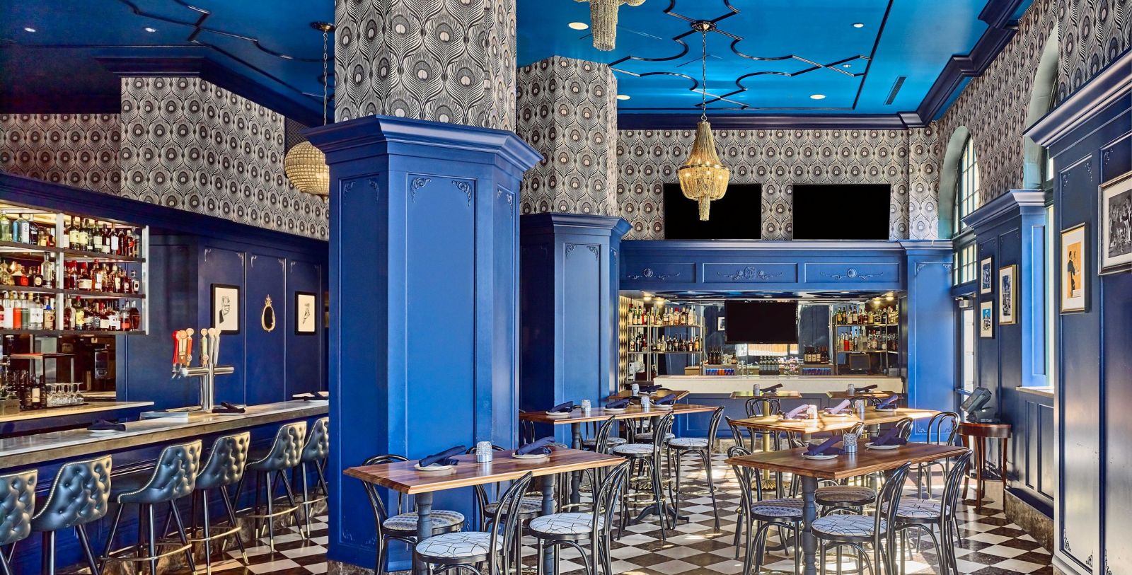 a blue and white room with tables and chairs