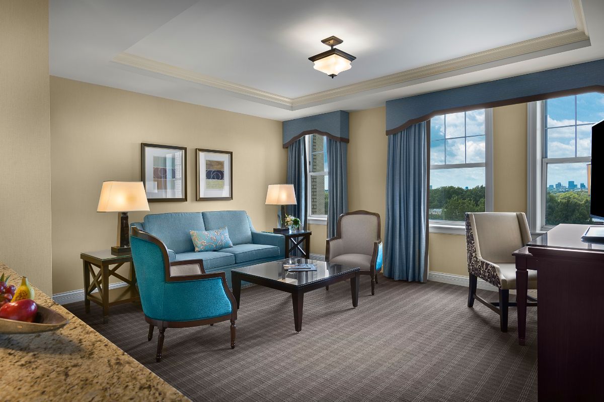 a room with blue and beige furniture