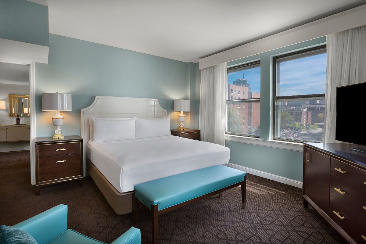 a bedroom with a bed and a window