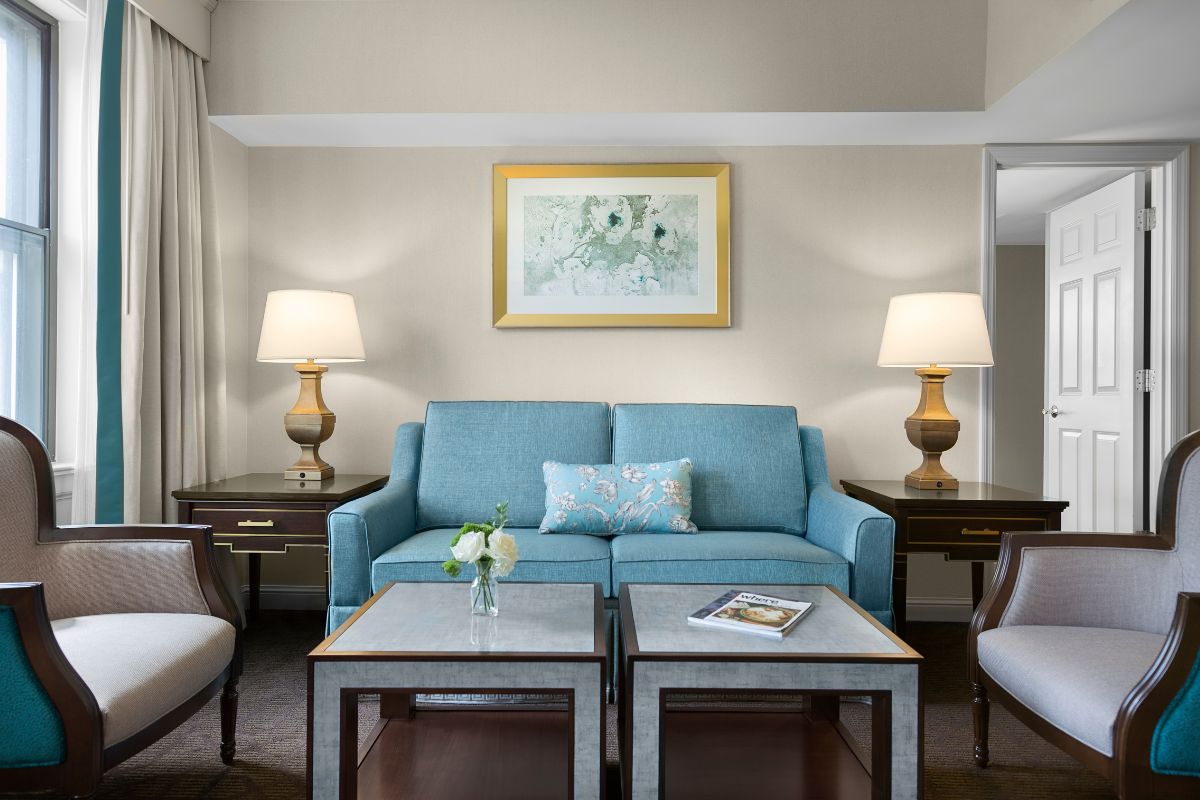 a living room with a couch and chairs