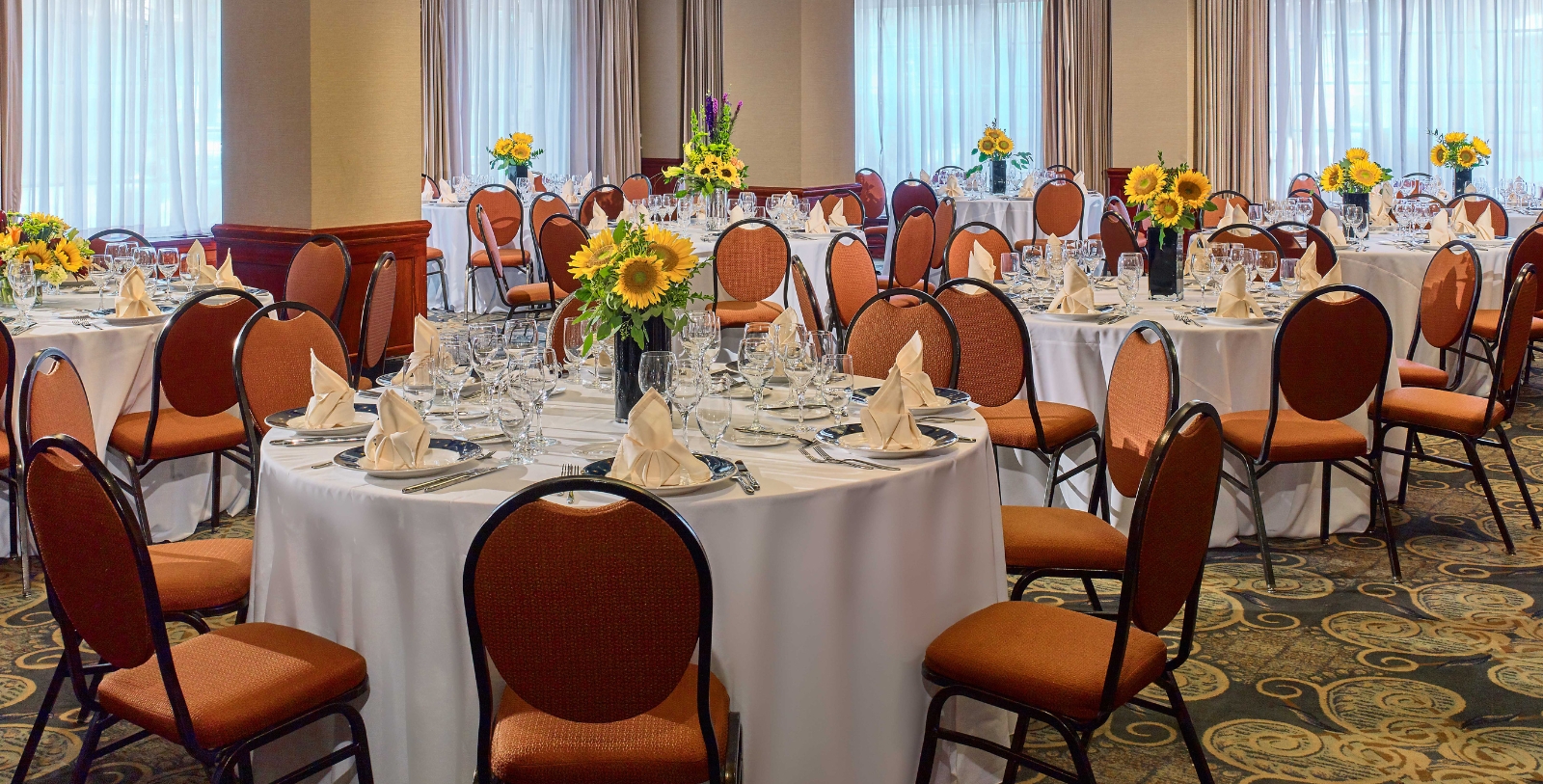 a room with tables and chairs