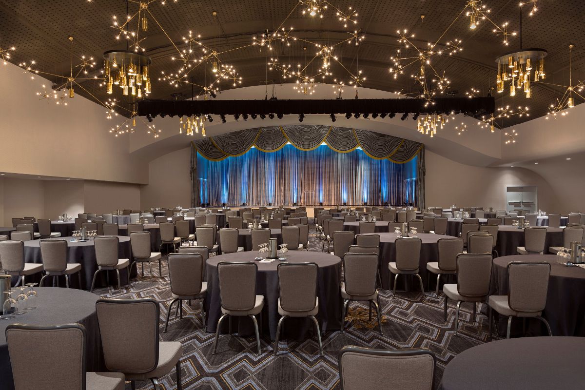 a room with round tables and chairs