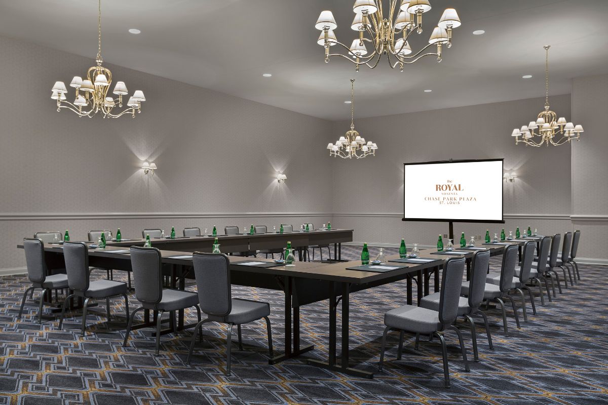 a room with a large table and chairs