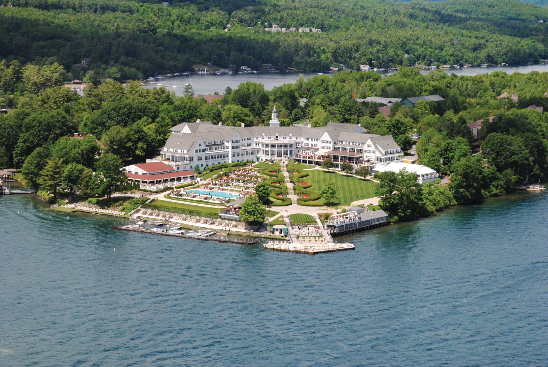a large white building surrounded by water
