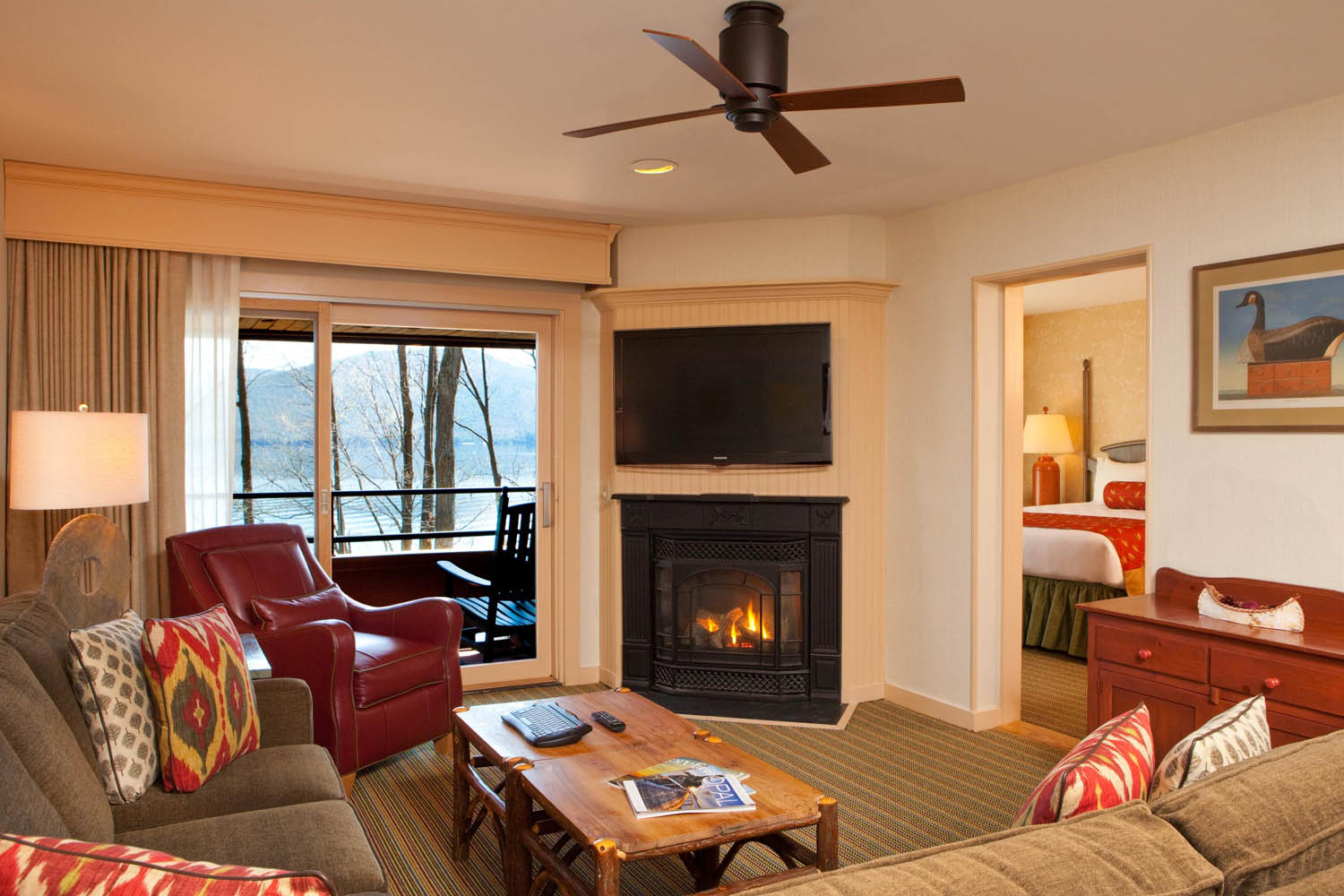 a living room with a fireplace and a television