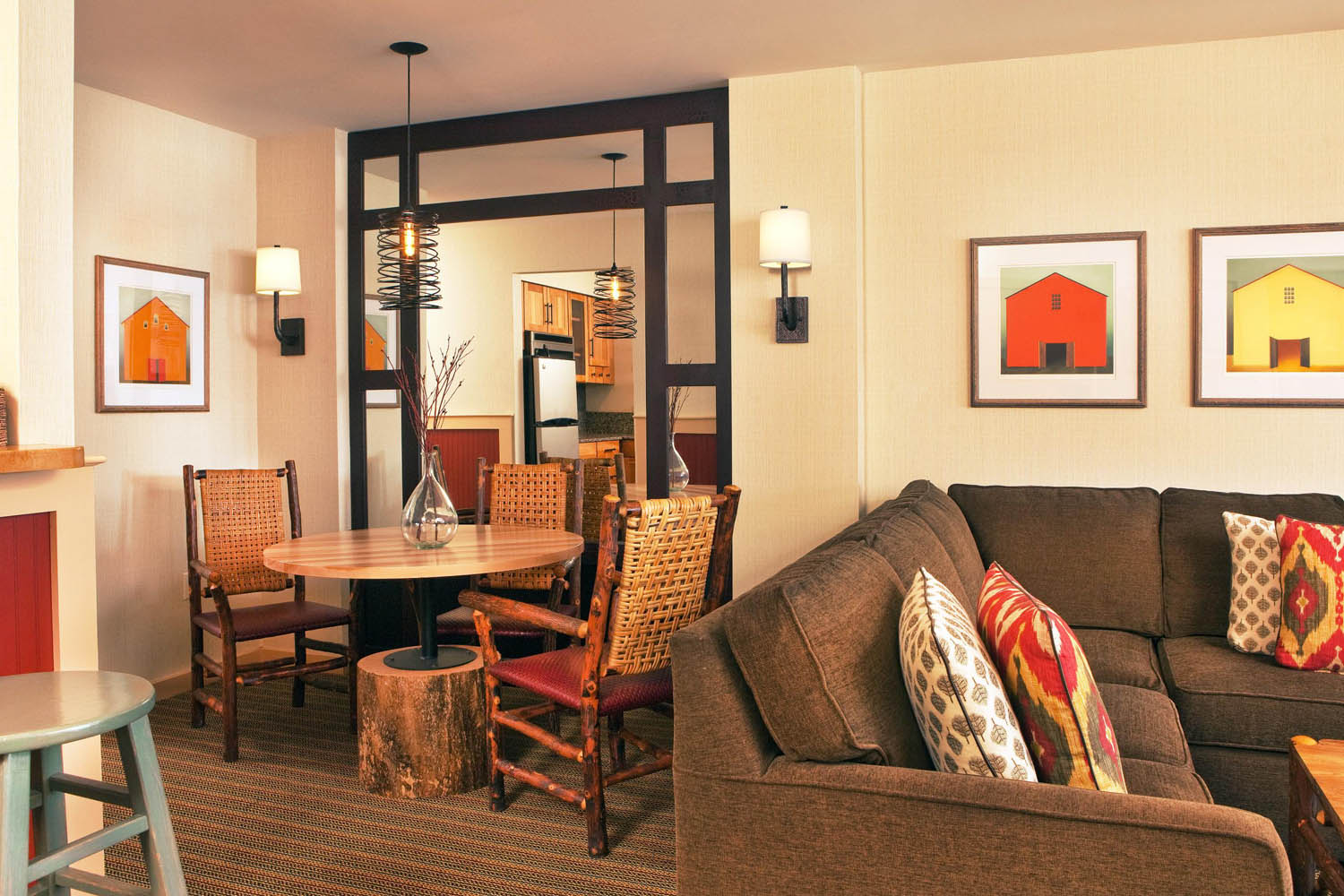 a living room with a table and chairs