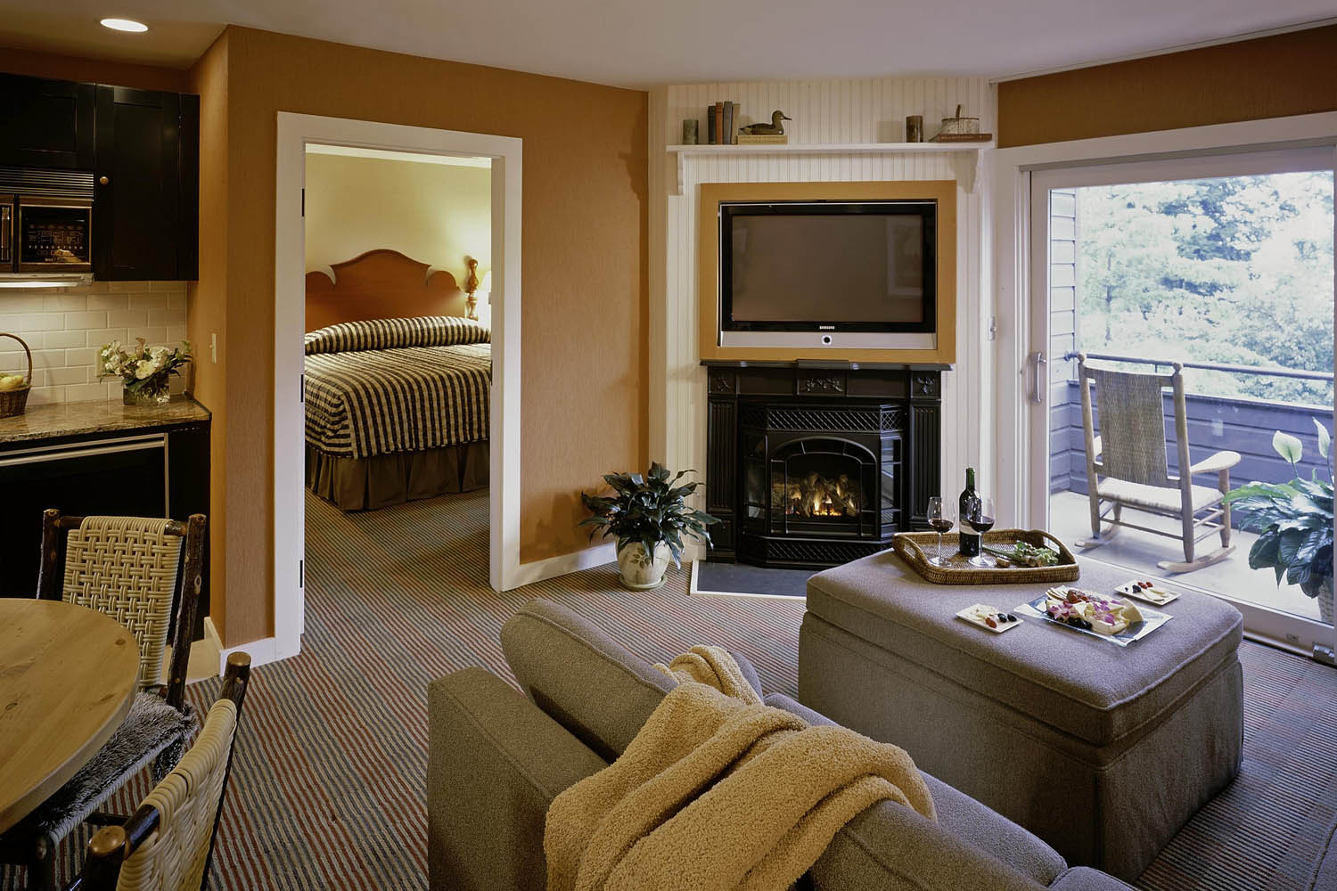 a living room with a fireplace and a television