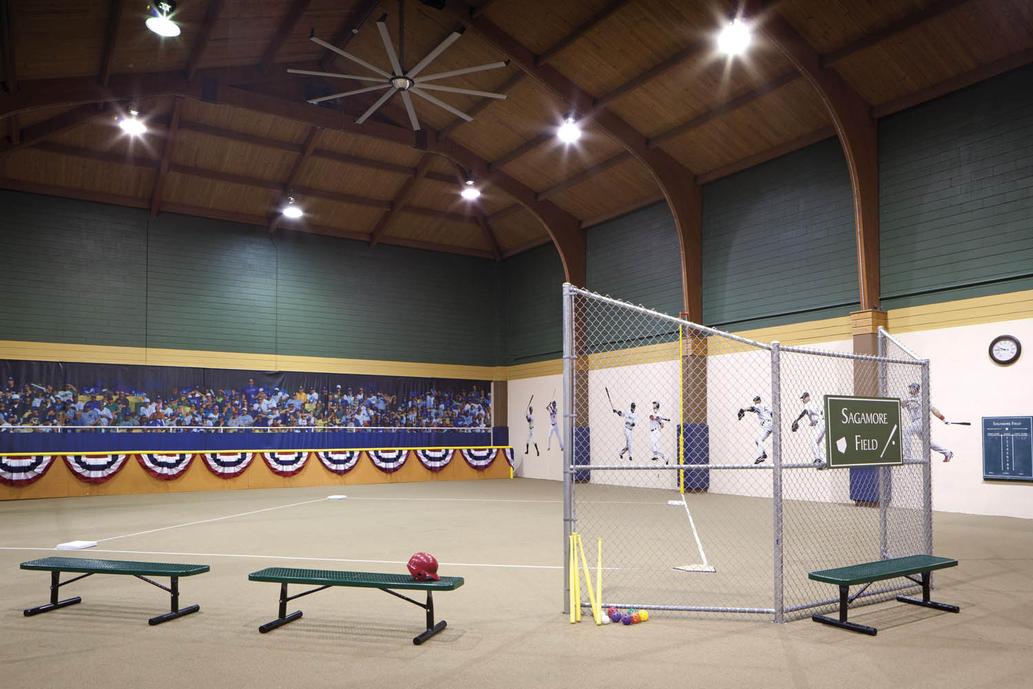 a sports hall with a baseball bat and a net