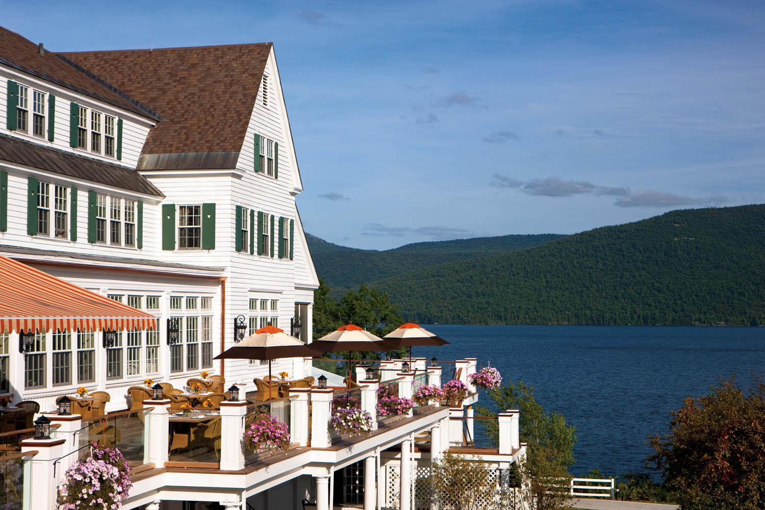 a large white house with a large body of water