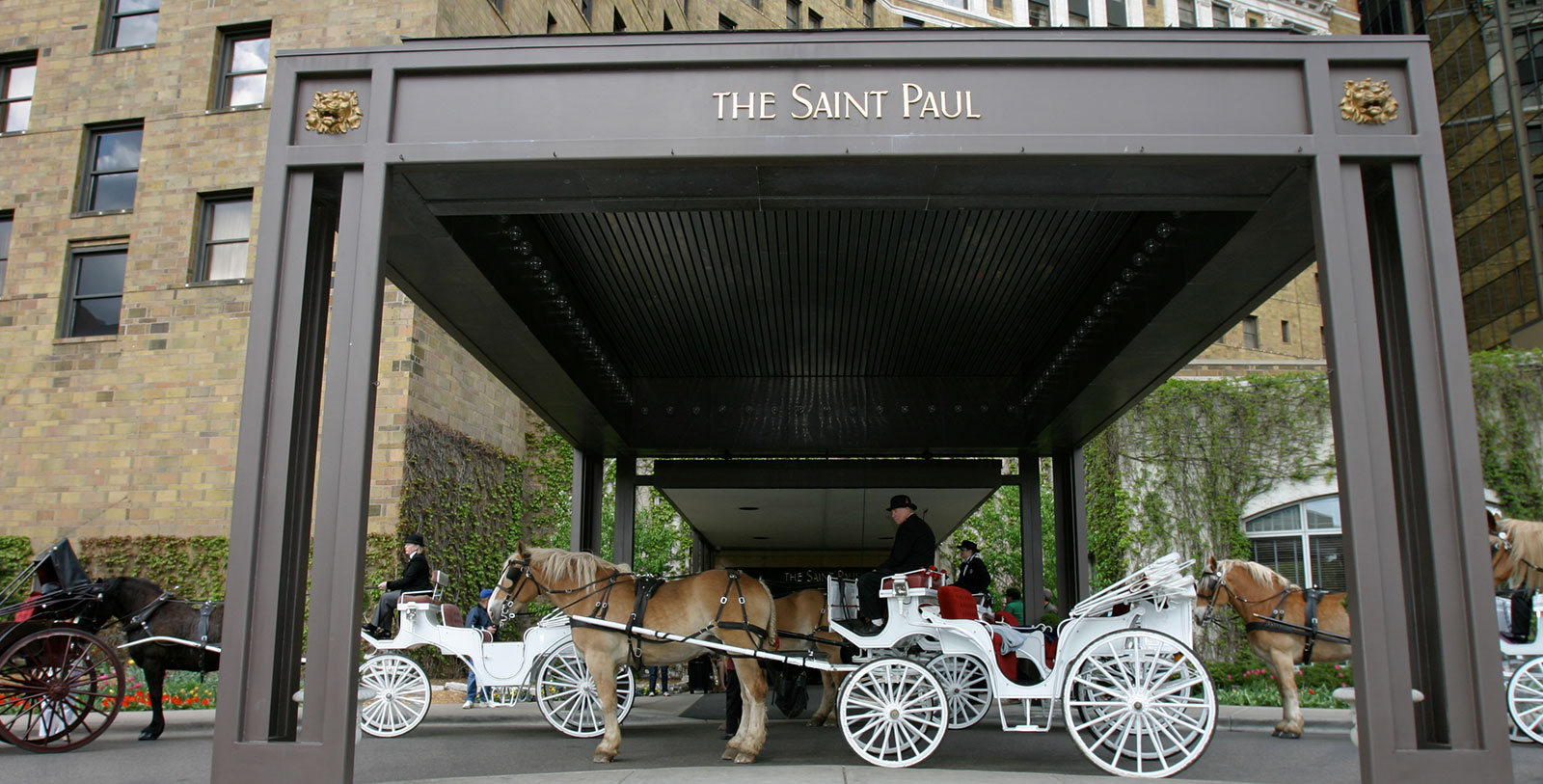 a horse carriage with people in it