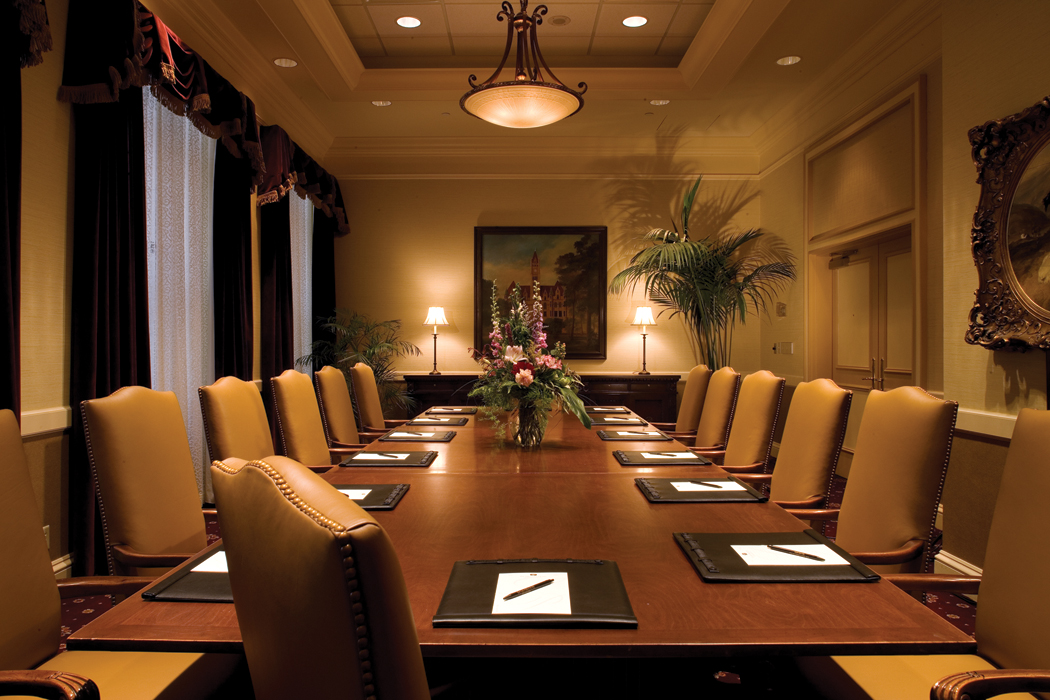 a conference room with a table and chairs