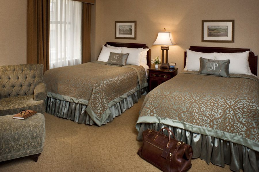 a hotel room with two beds