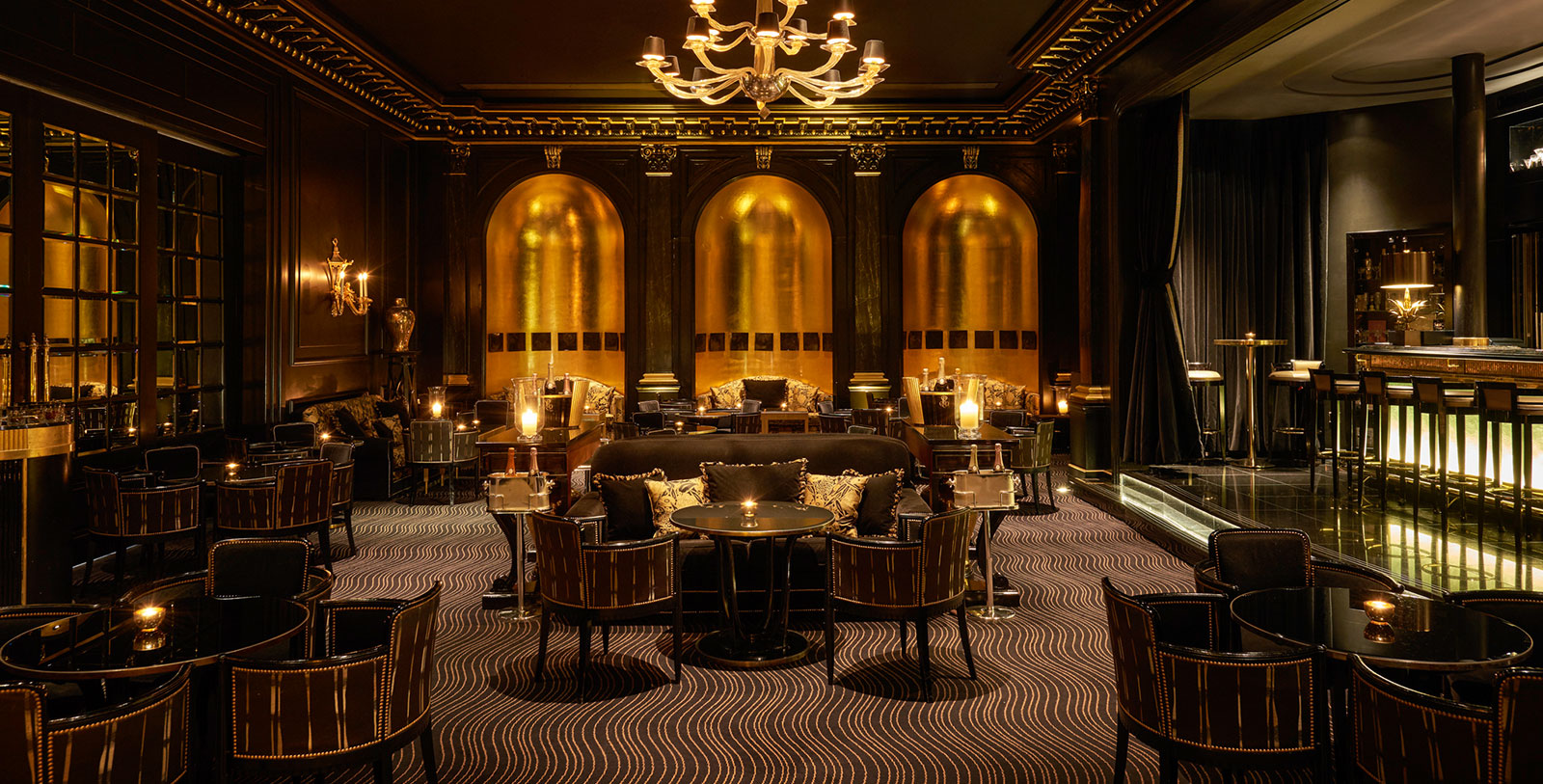 a room with a chandelier and tables