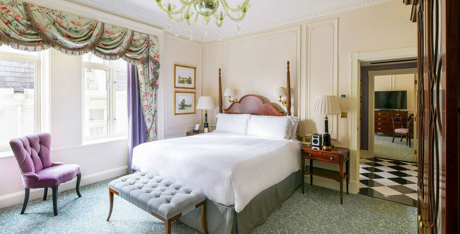 a bedroom with a bed and a bench