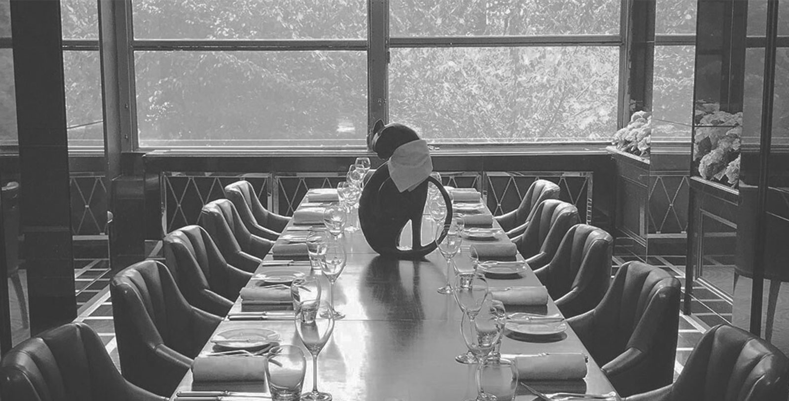 a table with a cat statue on it
